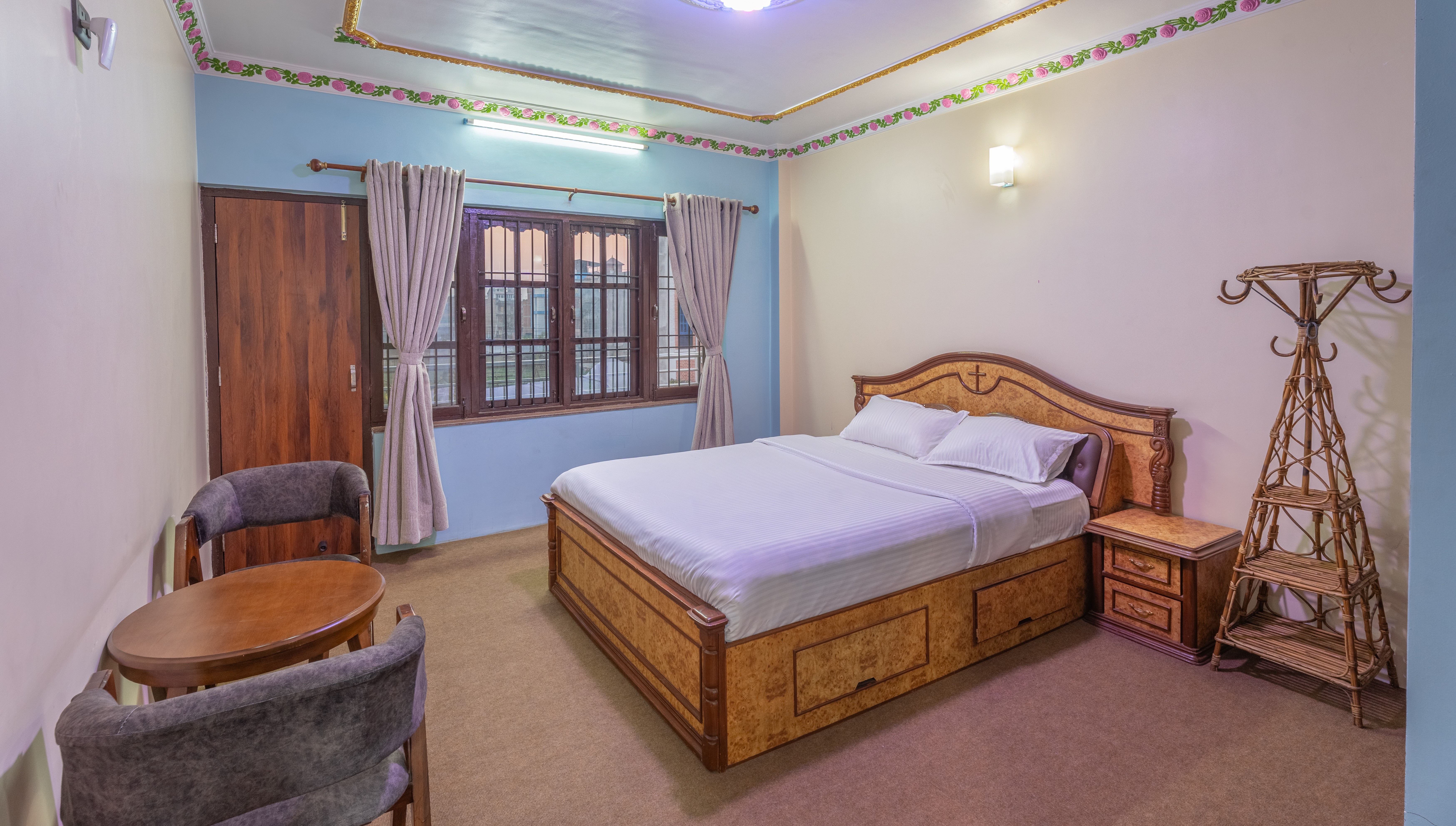 Master bedroom suite with private balcony at Aananda Homestay